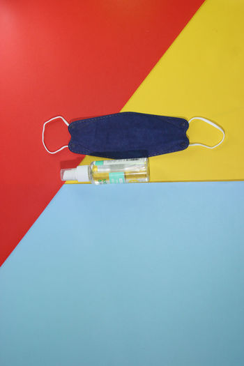 High angle view of electric lamp against blue background