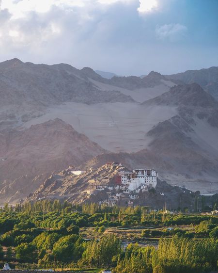 Scenic view of landscape and mountains against sky