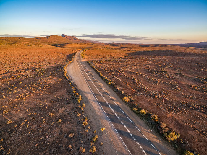High angle view of empty road at desert