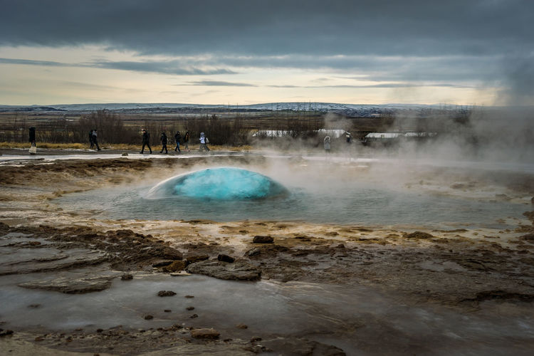 A bubble of water trapping the air as a geyser is about to erupt in iceland