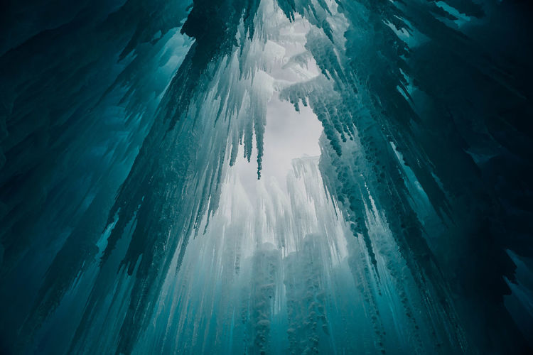 Low angle view of icicles in cave