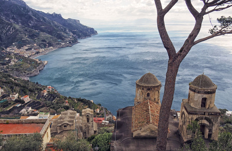 Panoramic view of sea and buildings against sky