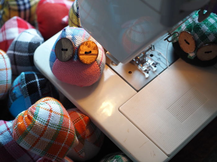 High angle view of toys on sewing machine