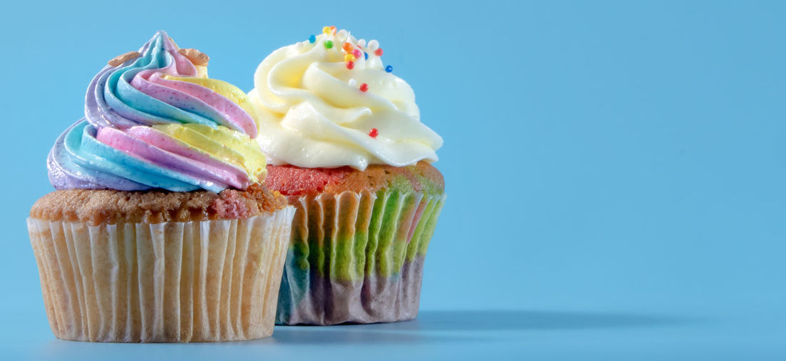 Close-up of cupcakes against white background
