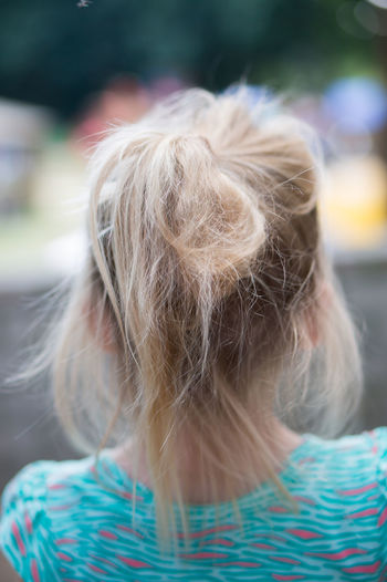 Rear view of girl with tangled blond hair