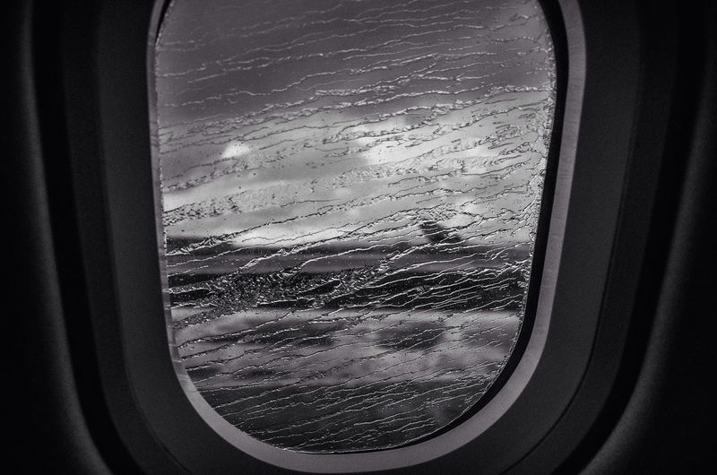 Cropped image of airplane window