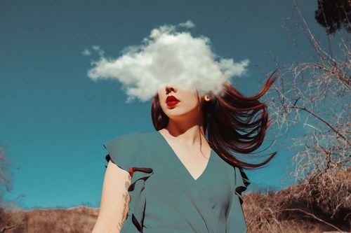 Digital composite image of young woman and cloud against sky