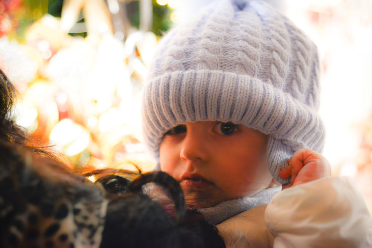 Close-up portrait of cute boy during winter