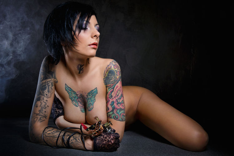 Naked woman with tattoos