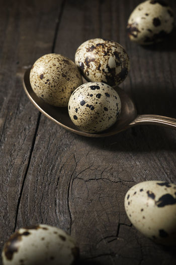 Quail eggs on a wooden table.