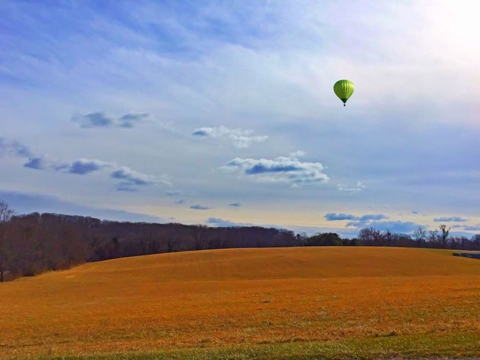 Hot air balloon over field