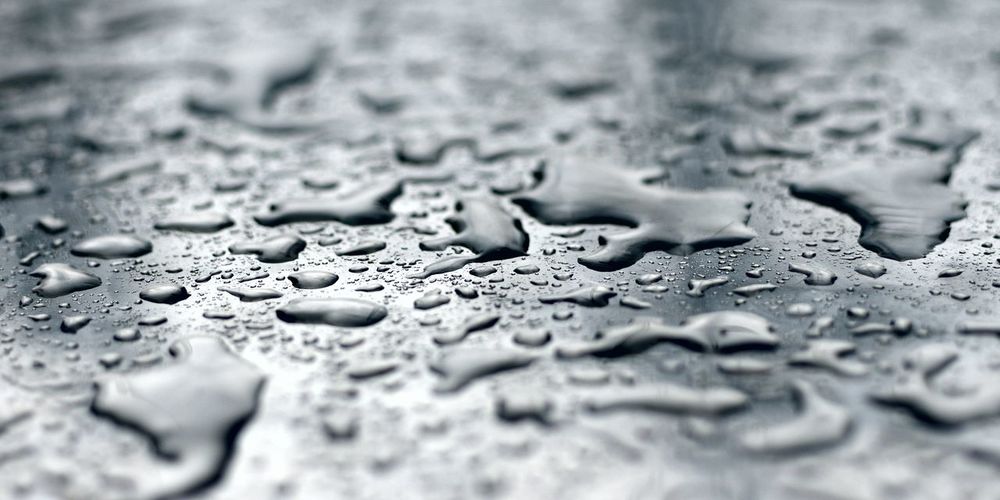 Full frame shot of raindrops on metal