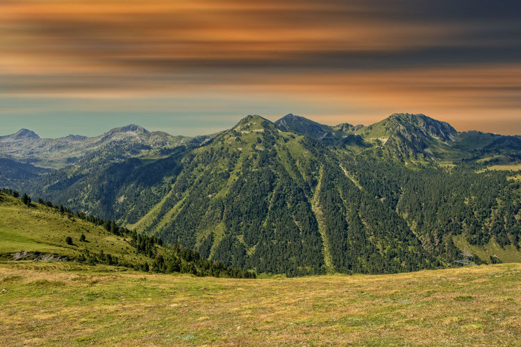 Scenic view of landscape against sky during sunset