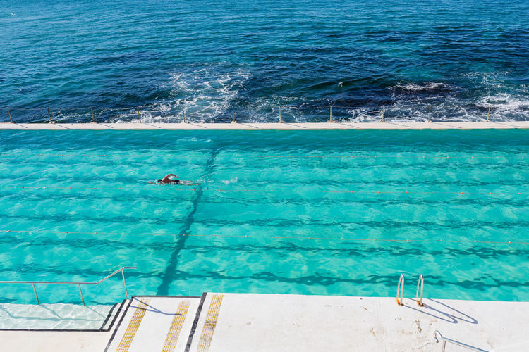 High angle view of swimming pool next to sea