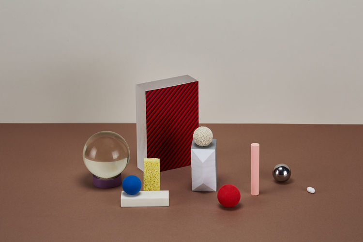 Various objects against wall on table