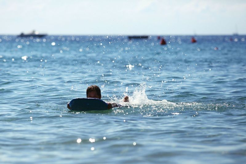 Man swimming in sea