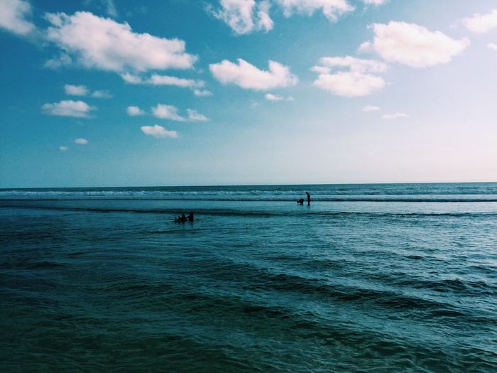 Scenic view of sea against cloudy sky