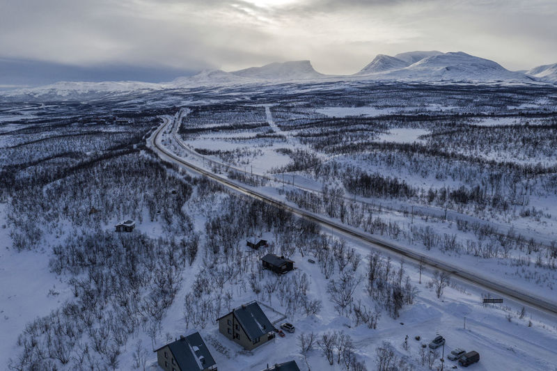 Aerial view of snowcapped mountains against sky