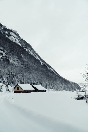 Scenic view of snow covered mountain against sky