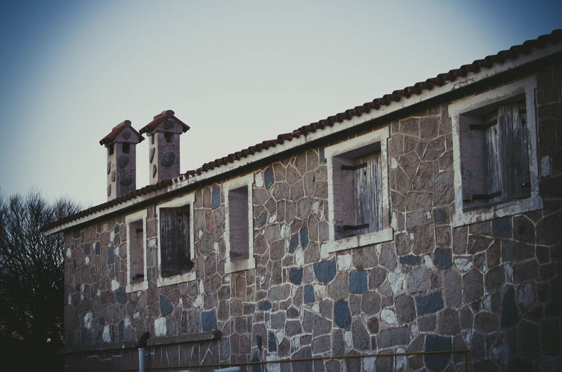 Low angle view of old building against sky