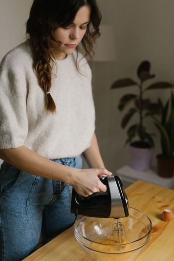 Young woman making christmas cookies