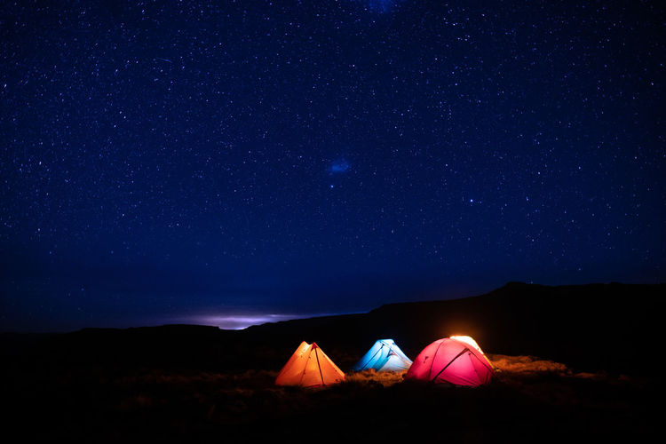 Low angle view of mountain against sky at night