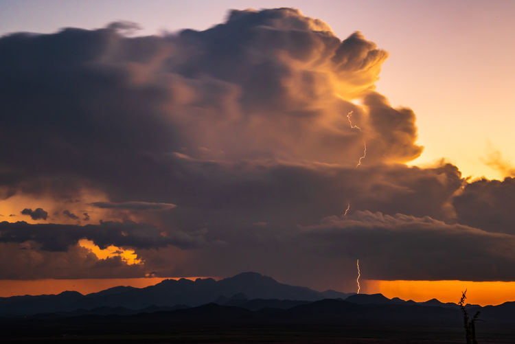 Scenic view of mountains against sky during sunset