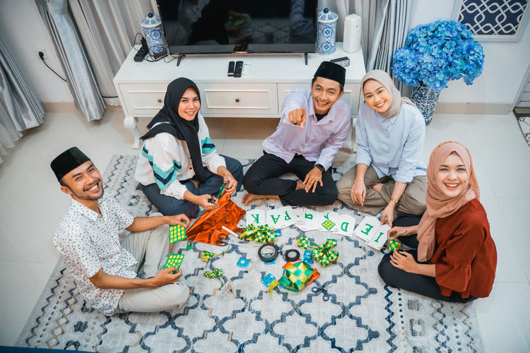 High angle view of female friends using digital tablet