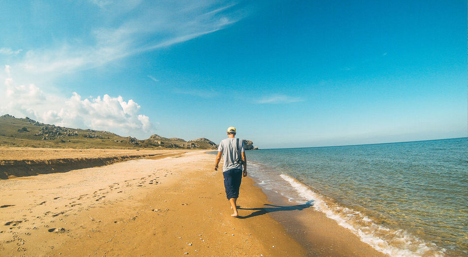 Man walks on the beach