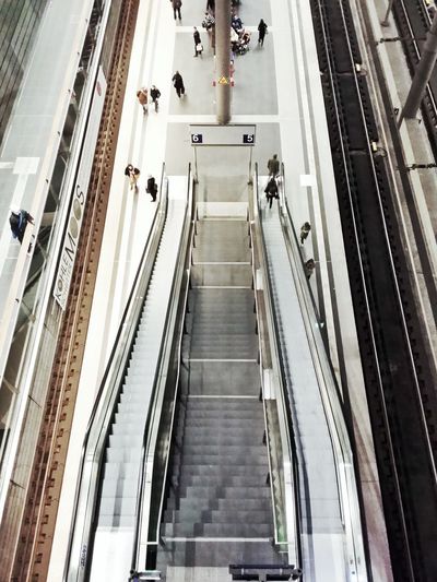 High angle view of steps and escalators at railroad station