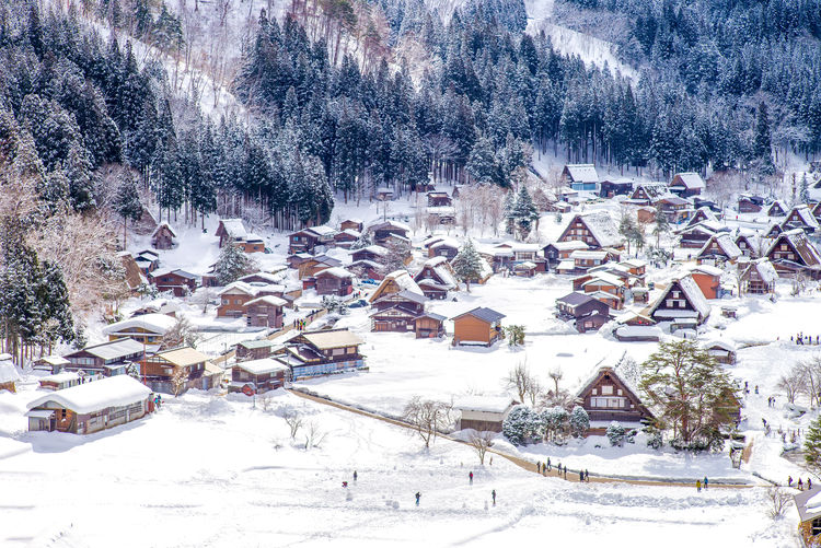 High angle view of houses on snow covered field
