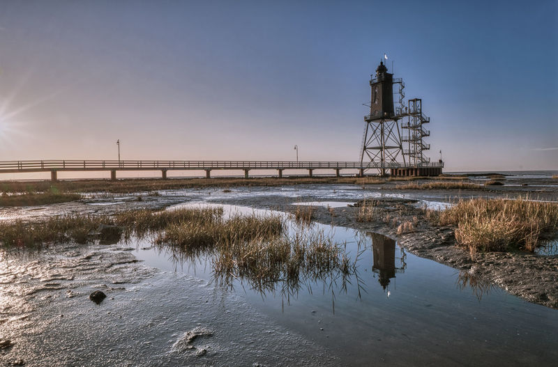 Bridge over sea against sky