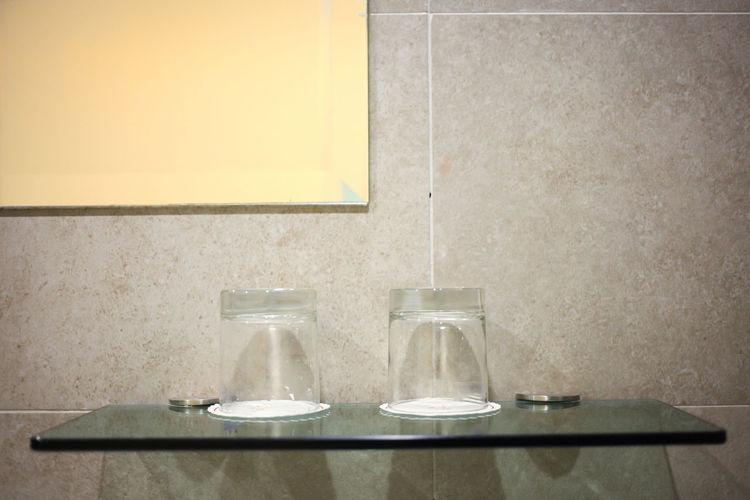 A pair of glass in toilet.
