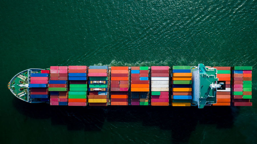 Container ship sailing the ocean, business cargo logistics service 