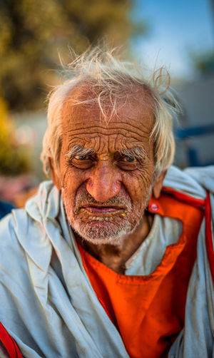 Close-up portrait of an old man outdoors