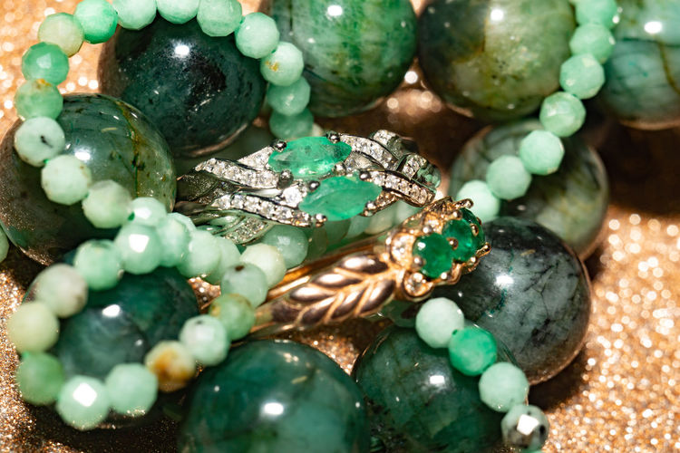 Natural emerald, beryl beaded bracelet, necklace and yellow gold ring.