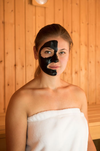 Portrait of beautiful woman with facial mask on face