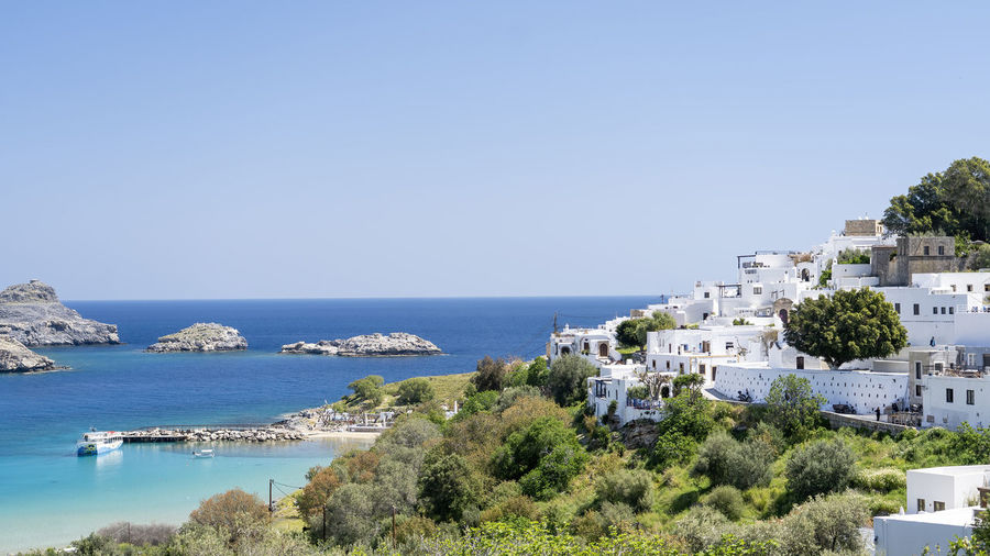 Panoramic view of lindos the city with white colored houses in greece.