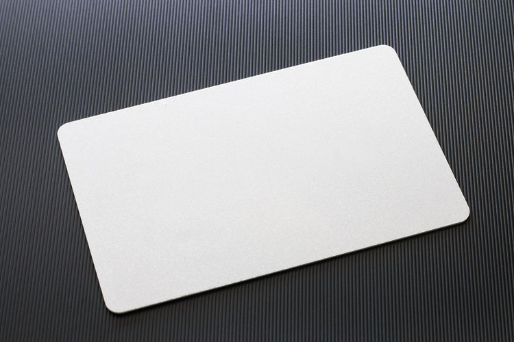 Close-up high angle view of mouse pad on table