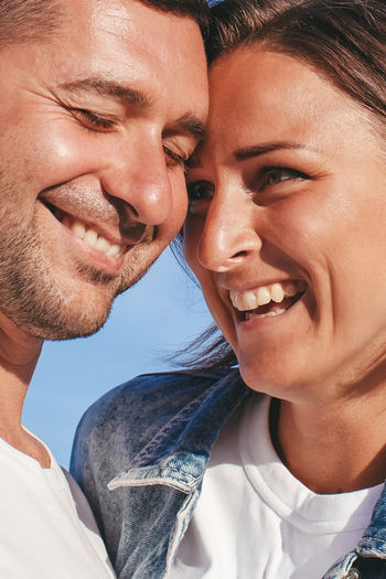 Happy portrait couple in love on the beach. family. diverse couple on summer vacation.
