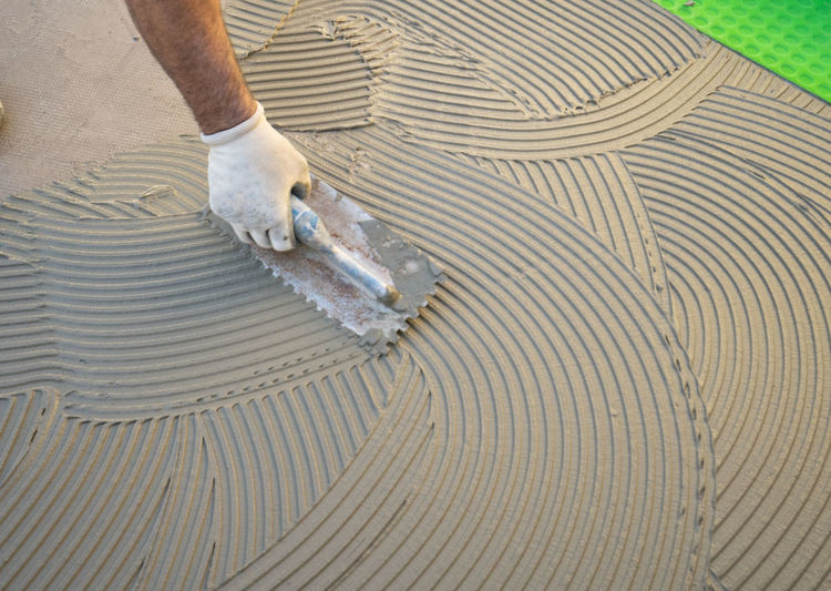 Low angle view of man working on wood