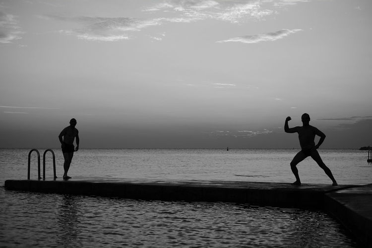 Man  on beach against sky