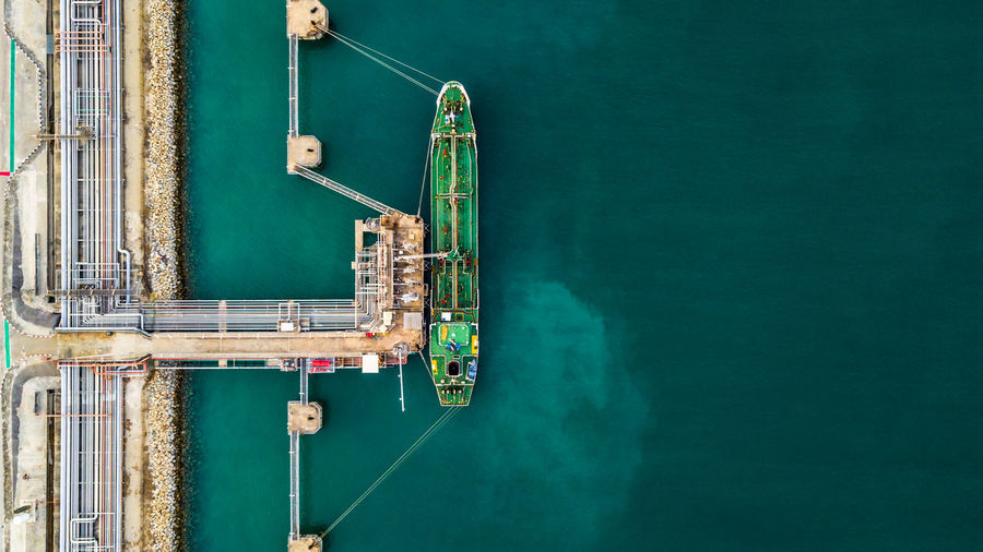Aerial view of cargo container moored at dock
