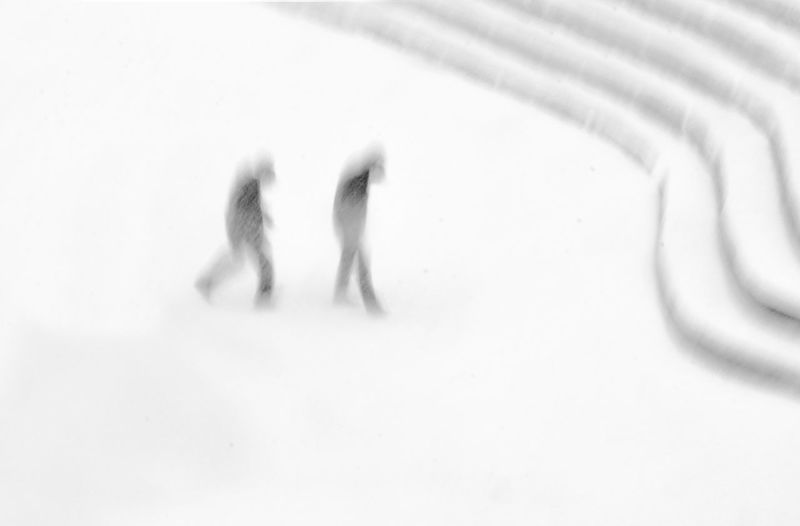 Group of people walking on snow