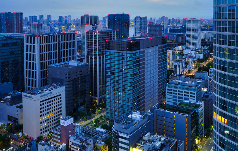 Aerial view of illuminated buildings in city