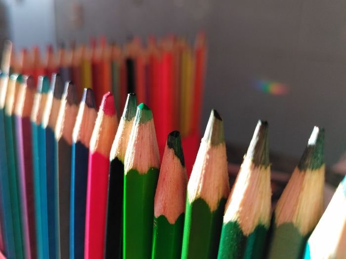 A row of colorful pencils