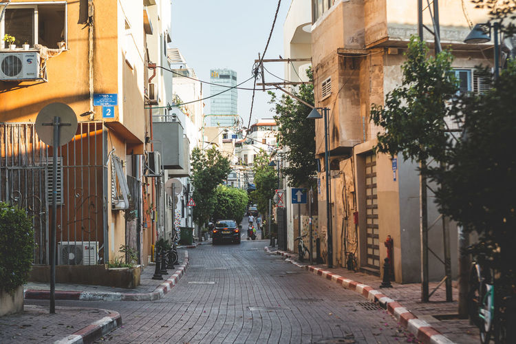 Alley amidst buildings in city