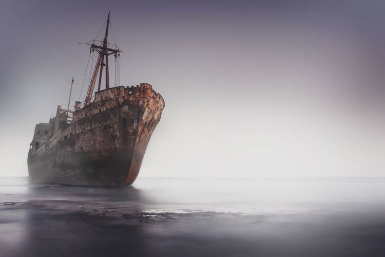 Low angle view of shipwreck against clear sky