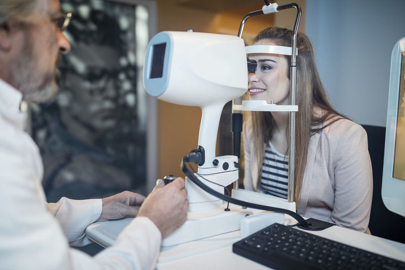 Young woman doing eye test at the optometrist's