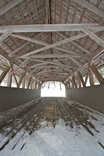 Full frame shot of covered bridge interior. wood post and beam construction 